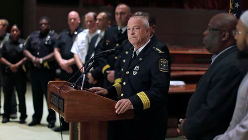 Police Chief Gary Stiles is at the podium at a July briefing where he talks about police shootings. BOB ANDRES / BANDRES@AJC.COM AJC File Photo