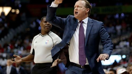 Hawks coach Mike Budenholzer yells to his players in the first half of Game 4 of a first-round NBA playoff series against Washington Monday night at Philips Arena. (AP photo)