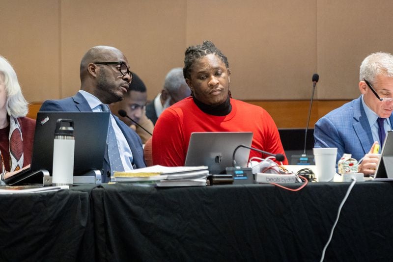 Atlanta rapper Young Thug (center) is seen in court during the ongoing “Young Slime Life” gang trial in Atlanta on Tuesday, October 31, 2023. (Arvin Temkar / arvin.temkar@ajc.com)