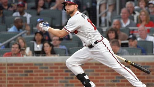 Braves center fielder Ender Inciarte hits a single in the first inning of the Braves home opener on Friday. HYOSUB SHIN / HSHIN@AJC.COM
