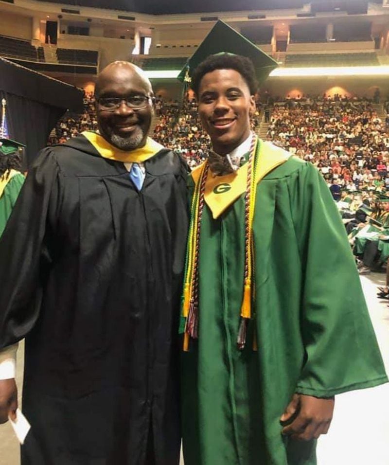 Georgia Tech freshman safety Jeremiah Smith at his graduation from Grayson High in May at Infinite Energy Arena in Gwinnett County. Smith is with his father Rudy, who is a special-education teacher at the school. (Photo courtesy Rudy Smith)