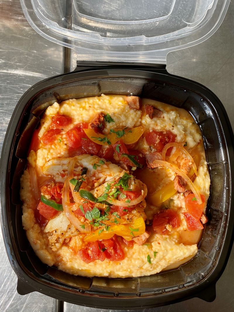 Chef Wes McNeill moved here from Charleston, South Carolina, where he’d had his fill of shrimp and grits, so he serves fish and grits at Hot Betty’s in Tucker. Wendell Brock for The Atlanta Journal-Constitution
