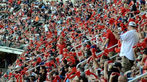 Braves fans wave red styrofoam tomahawks in unison on Monday, Oct. 8, 2018. Mitchell Northam/AJC