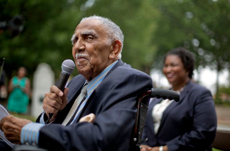 Rev. Joseph E. Lowery speaks at a 2013 event in Atlanta announcing state lawmakers from around the county have formed an alliance they say will combat restrictive voting laws.  Former state legislator and gubernatorial candidate Stacey Abrams is in the background. (AP Photo/David Goldman, File)