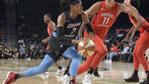 Atlanta Dream guard Brittney Sykes (7) drives against the defense of Washington Mystics guard Elena Delle Donne (11) during the first half of Game 2 of a WNBA semifinals basketball playoff Tuesday, Aug. 28, 2018, in Atlanta. (AP Photo/John Amis)