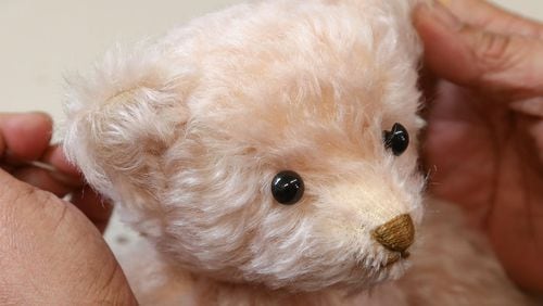 FILE PHOTO: A teddy bear is completed at the Steiff stuffed toy factory.