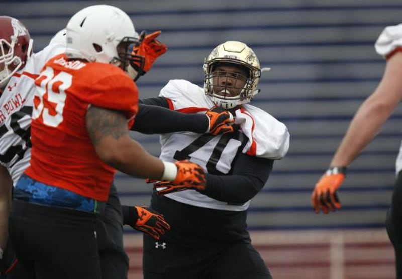 Western Michigan's Willie Beavers (70), runs through drills during NCAA college football practice for the Senior Bowl, Wednesday, Jan. 27, 2016, at LaddPeebles Stadium, in Mobil, Ala. (AP Photo/Brynn Anderson)