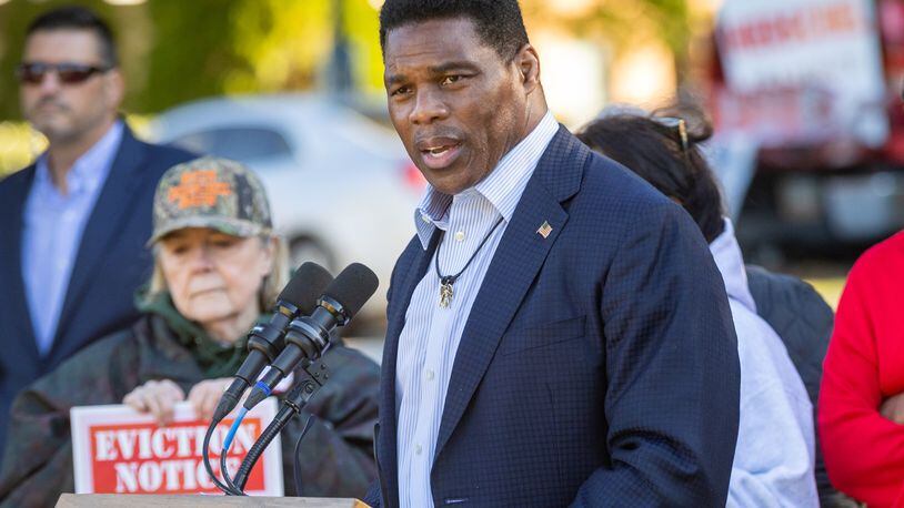 Republican Herschel Walker speaks Tuesday near the Columbia Tower at MLK Village apartments in Atlanta, where he tried to blame Ebenezer Baptist Church and his opponent, Democratic U.S. Sen. Raphael Warnock,, the church's senior pastor, of trying to evict disadvantaged residents. The building is owned by a for-profit entity with ties to Warnock and Ebenezer. A spokesman for the building said no evictions have taken place at there for failure to pay rent since June 2020. Steve Schaefer/steve.schaefer@ajc.com)