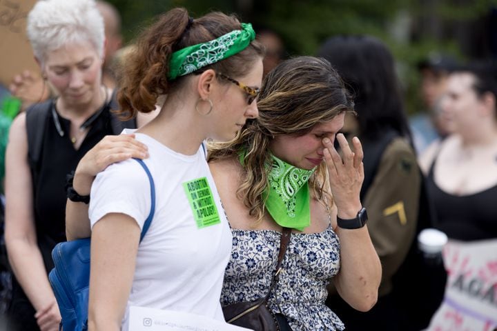 Abortion rights activists rally at Centennial Olympic Park in Atlanta on Friday, June 24, 2022. The protest follows the Supreme Court’s overturning of Roe v Wade. (Arvin Temkar / arvin.temkar@ajc.com)