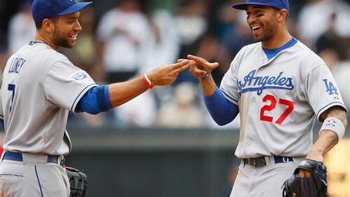 Matt Kemp and James Loney were teammates with the Dodgers from 2006-2012, and they might soon be teammates again after the Braves signed Loney to a minor league contract to potentially help fill in for injured first baseman Freddie Freeman. (AP Photo/Lenny Ignelzi)