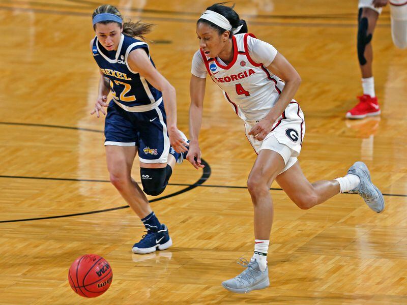 Georgia guard Mikayla Coombs (4) steals the ball as Drexel guard Erin Sweeney (12) follows during the first half of their first-round women's NCAA tournament game Monday, March 22, 2021, at the Greehey Arena in San Antonio, Texas. (Ronald Cortes/AP)