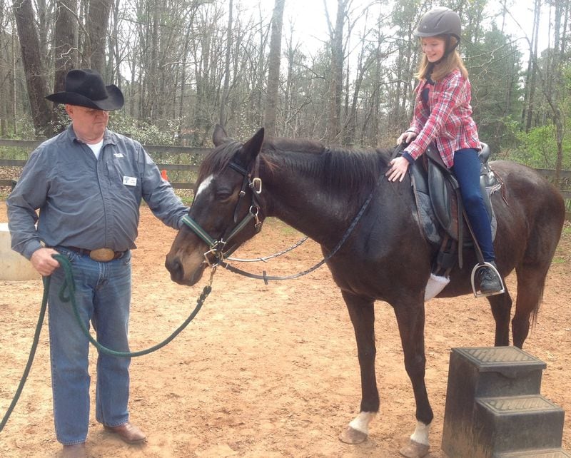 Madison Kaul, a sixth-grader at High Meadows School in Roswell, rides Bella Luna for the first time. Kaul helped take care of the thoroughbred after she arrived at the school late last year near death. CONTRIBUTED BY ANGELA LOCKARD