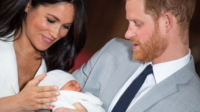Prince Harry, Duke of Sussex and Meghan, Duchess of Sussex, pose with their newborn son Archie Harrison Mountbatten-Windsor during a photocall in St George's Hall at Windsor Castle on May 8, 2019 in Windsor, England. The Duchess of Sussex gave birth at 05:26 on Monday 06 May, 2019.