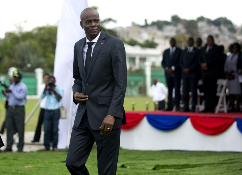 Haiti's President Jovenel Moise attends a ceremony in Port-au-Prince, Haiti, Friday, Jan. 12, 2018. Haitians reacted with outrage Friday to reports that President Donald Trump questioned why the U.S. would accept more immigrants from Haiti and "shithole countries" in Africa at an Oval Office meeting held on the eve of the anniversary of the 2010 earthquake. Moise's government issued a strongly worded statement denouncing what it called a "racist" view of Haitian immigrants and people from African countries. (AP Photo/Dieu Nalio Chery)