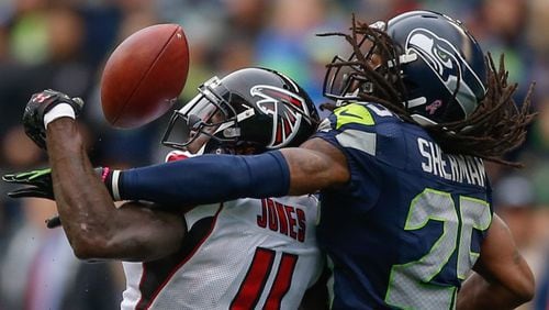 Falcons wide receiver Julio Jones is defended by cornerback Richard Sherman on a fourth down play that ended Atlanta's drive in the final minutes of Seattle's 36-34 win Oct. 26, 2016, at CenturyLink Field in Seattle.