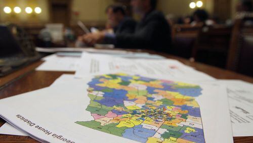 A Georgia map lays on a table in a courtroom. 2016 census data shows Fulton County’s population is larger than that of 76 countries.