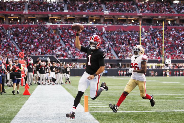Falcons quarterback Marcus Mariota crosses the goal line against the 49ers on Sunday in Atlanta. (Miguel Martinez / miguel.martinezjimenez@ajc.com)