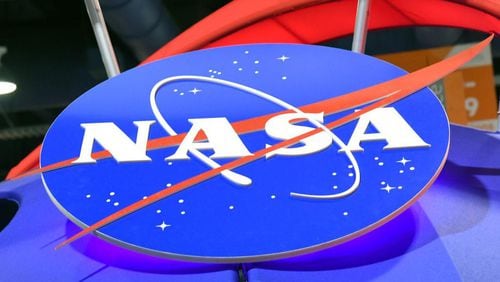 The NASA logo is displayed at the agency's booth during CES 2018 at the Las Vegas Convention Center on January 11, 2018 in Las Vegas, Nevada.
