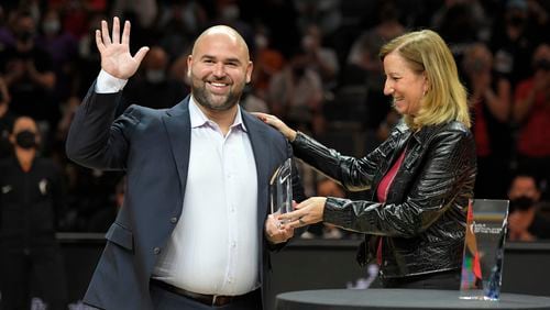 WNBA commissioner Cathy Engelbert (right) awards Las Vegas Aces general manager of basketball operations Dan Padover, the 2021 WNBA Basketball Executive of the Year award before Game 2 in the semifinals of the WNBA playoffs between the Las Vegas Aces and the Phoenix Mercury Thursday, Sept. 30, 2021, in Las Vegas. (David Becker/AP)