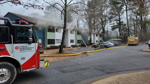 Gwinnett County firefighters extinguished a blaze at the Terra at Norcross apartments after receiving a call from a plumber who noticed smoke in a water heater closet.