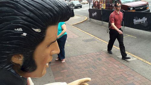 A Fiberglas Elvis is caught in permanent "uh-huh-huh" in downtown Nashville, where the governor recently vetoed a bill making the Bible the state book of Tennessee. Other lawmakers across the country are dealing with bills with religious subtexts. MARK DAVIS/MRDAVIS@AJC.COM