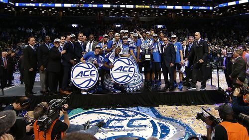 The Duke Blue Devils hold up the trophy after defeating the Notre Dame Fighting Irish 75-69 in the championship game of the 2017 Men’s ACC Basketball Tournament at the Barclays Center on March 11, 2017 in New York City. (Photo by Al Bello/Getty Images)
