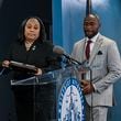 
                        FILE  — Fulton County District Attorney Fani Willis, left, and the special prosecutor Nathan Wade, right, at a news conference in Atlanta on Aug. 14, 2023. An Atlanta judge on Friday, March 15, 2024, ruled that Willis could continue leading the prosecution of former President Donald Trump and his allies in Georgia, but only if Wade, her former romantic partner, withdraws as the lead prosecutor of the case. (Kenny Holston/The New York Times)
                      