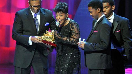 Anita Baker reacts as she receives Legend Award from Michael Baisden (left) during the 2010 Soul Train Awards at the Cobb Energy Performing Arts Centre on Wednesday, Nov. 10, 2010.