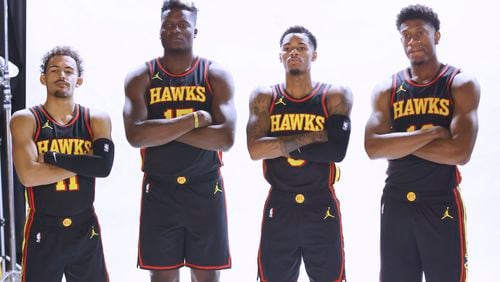 Hawks players, left to right, Trae Young, Clint Capela, Dejounte Murray and De’Andre Hunter poses for a photograph during the Hawks Media Day on Monday, October 2, 2023, in Atlanta.Miguel Martinez /miguel.martinezjimenez@ajc.com