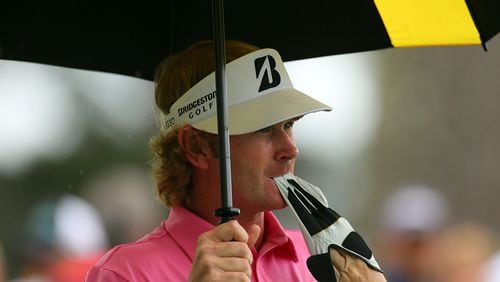 Brandt Snedeker pulls off his glove after hitting his shot short from the No. 4 tee during the final round in the Masters Tournament at Augusta National Golf Club.
