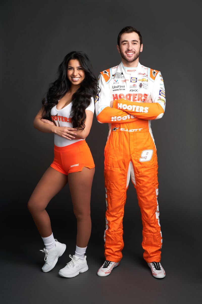 Chase Elliott poses with Hooters server and Gwinnett County resident Chela Gamboa. (Courtesy of Chris Stanford/Hooters of America)
