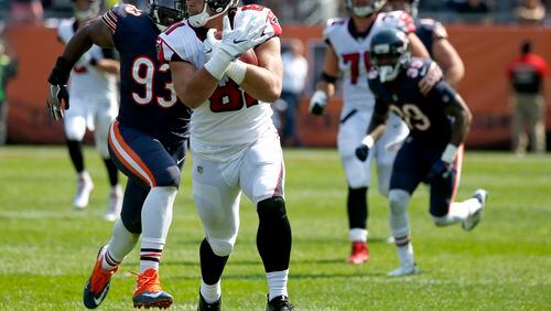 Atlanta Falcons tight end Austin Hooper (81) runs past Chicago Bears linebacker Sam Acho (93) after making a pass reception during the second half of an NFL football game, Sunday, Sept. 10, 2017, in Chicago. (AP Photo/Nam Y. Huh)