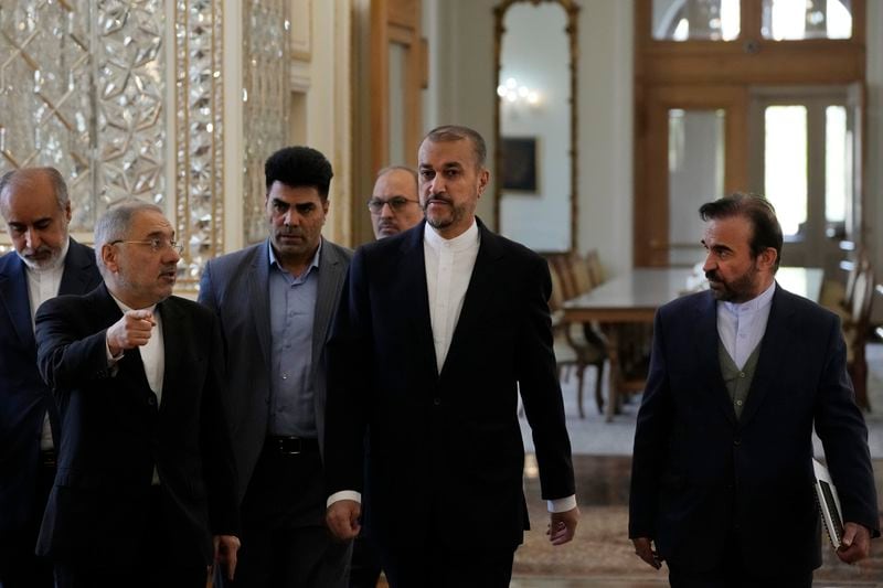 Iranian Foreign Minister Hossein Amirabdollahian, center, arrives for a meeting with foreign ambassadors and envoys to Tehran, Iran, Sunday, April 14, 2024. Iran launched its first direct military attack against Israel on Saturday night in response to a strike widely blamed on Israel that hit an Iranian consular building in Syria earlier this month and killed two Iranian generals. (AP Photo/Vahid Salemi)