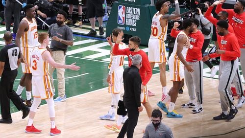 The Atlanta Hawks celebrate as time expires in a 116-113 victory over the Milwaukee Bucks in game 1 of the NBA Eastern Conference Finals on Wednesday, June 23, 2021, in Milwaukee.   “Curtis Compton / Curtis.Compton@ajc.com”