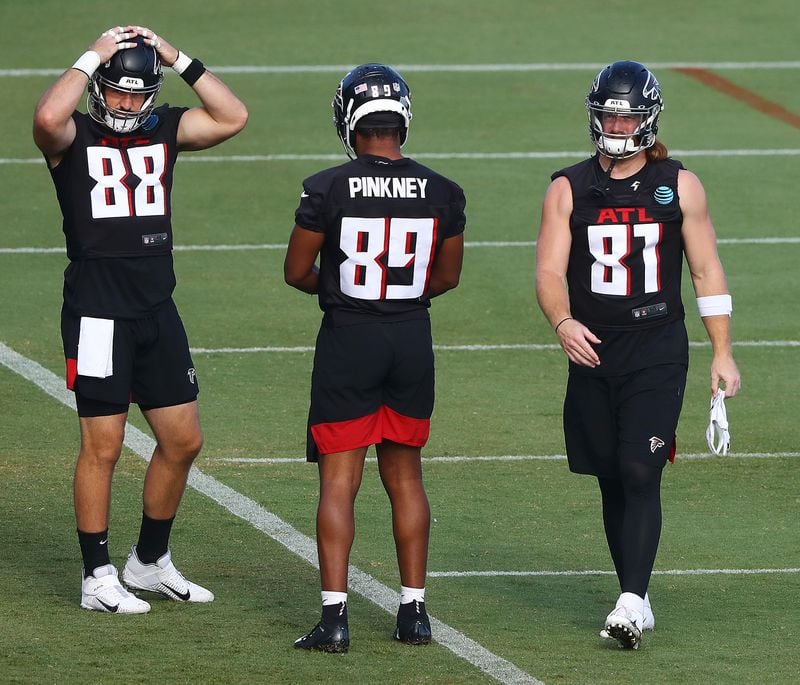 Falcons tight ends Luke Stocker (left), Jared Pinkney and Hayden Hurst take the field for training camp on Wednesday, August 19, 2020 in Flowery Branch.    Curtis Compton ccompton@ajc.com