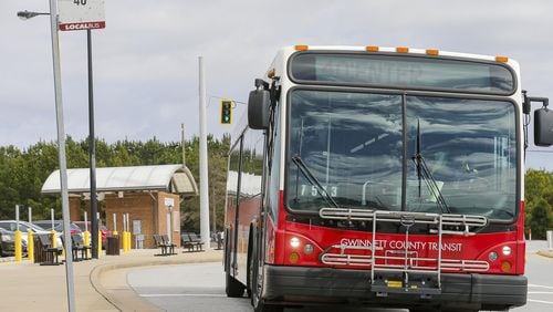 A Gwinnett County Transit bus travels along North Brown Road near a Gwinnett County Transit Park and Ride bus station in Lawrenceville on Tuesday, Feb. 26, 2019. (ALYSSA POINTER/ALYSSA.POINTER@AJC.COM)