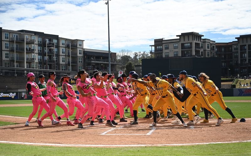 Party Animals and Savannah Bananas players have a dance battle before the game. (Hyosub Shin / Hyosub.Shin@ajc.com)
