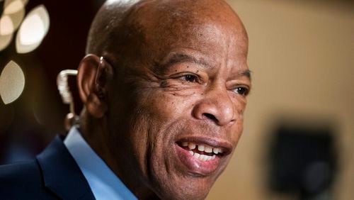 FILE - In this July 16, 2019, file photo, Rep. John Lewis, D-Ga., speaks during a television interview at the Capitol in Washington. Robert E. Lee High School in Virginia has been renamed for the Congressman. (AP Photo/J. Scott Applewhite, File)