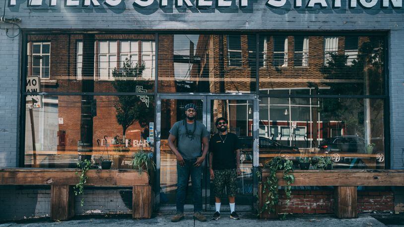 Gilly Brew Bar owner Daniel Brown (left) and Miya Bailey are seen in front of Peters Street Station, a multi-use venue in Castleberry Hill that will serve as the home of the second Gilly location. CONTRIBUTED BY GARY FORTNER