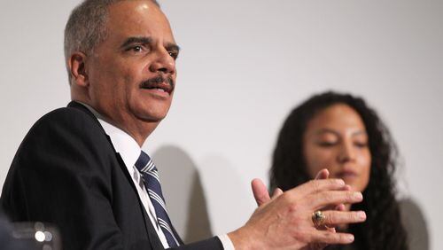 Former U.S. Attorney General Eric Holder speaks while fellow panelist Elizabeth Hinton listens in the background at the Jimmy Carter Presidential Library and Museum in Atlanta in 2017. Holder is the chairman of a Democratic political group that filed a lawsuit attempting to throw out Georgia’s congressional districts. (HENRY TAYLOR / HENRY.TAYLOR@AJC.COM)