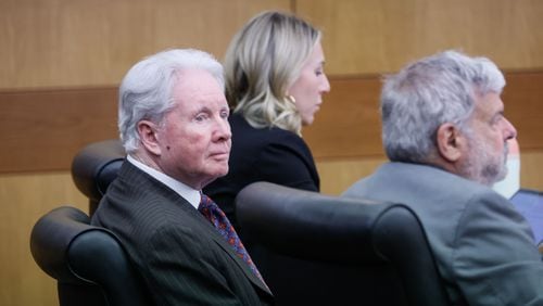 Former attorney Claud “Tex” McIver, flanked by his lawyers Amanda R. Clark Palmer and Donald F. Samuel, watches prosecutors speak to Fulton County Superior Court Judge Robert C.I. McBurney during the first day of his murder retrial on Monday. The retrial was delayed indefinitely Tuesday.
Miguel Martinez /miguel.martinezjimenez@ajc.com