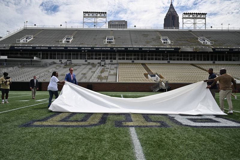 Peyton Manning helps unveil Demaryius Thomas' initials and number of the field at Georgia Tech Monday. Photo by Danny Karnik / Georgia Tech Athletics