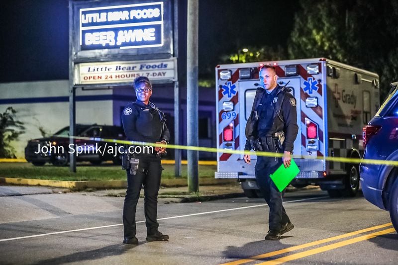 Investigators believe the shooter went through the victim's pockets before leaving him outside the Little Bear Food Mart on Jonesboro Road, according to police. 