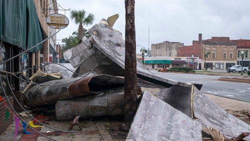 10/11/2018 -- Albany, Georgia -- Debris lines the sidewalks on West Broad Avenue in Albany following Hurricane Michael, Thursday, October 11, 2018. Hurricane Michael passed through Albany Wednesday evening as a Category 2 hurricane.  (ALYSSA POINTER/ALYSSA.POINTER@AJC.COM)