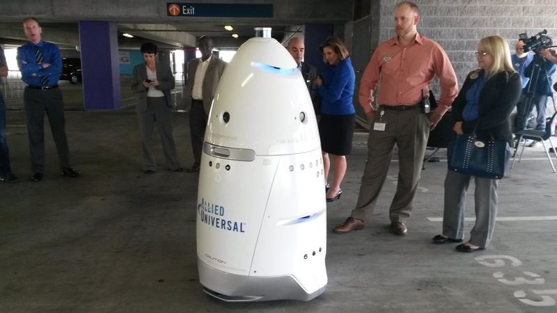 The nation’s largest security services company, Allied Universal, recently pitched some of its Georgia corporate and nonprofit customers on the option of renting robot security guards for patrols. One recent demonstration was at the Georgia Aquarium, which is planning to test one of the robots in action this summer in a parking garage. MATT KEMPNER / AJC