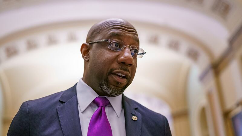 U.S. Sen. Raphael Warnock took a quick break from the runoff campaign trail to travel to the Capitol and vote Wednesday for a measure giving federal protections to same-sex and interracial marriage. (J. Scott Applewhite/AP)