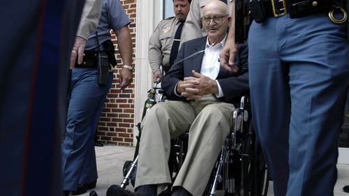 Edgar Ray Killen is wheeled from the courthouse after his conviction Tuesday in Philadelphia, Miss., on three felony counts of manslaughter in the 1964 killings of three civil rights workers. The Klansman masterminded the executions.. (Lori Waselchuk/The New York Times)