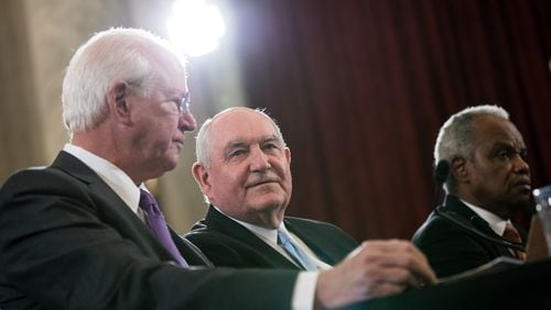 Former Georgia Gov. Sonny Perdue, center, has gained a lot of attention recently in his role as secretary of agriculture. (Photo by Drew Angerer/Getty Images)