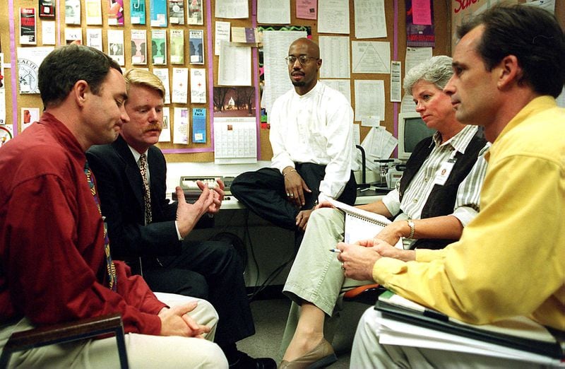 From left, Tony Braswell, Mark S. King, Craig Washington, Gayle Mingledorff and David Powers at an AID Atlanta staff meeting in January 1997. Photo: Nick Arroyo/AJC