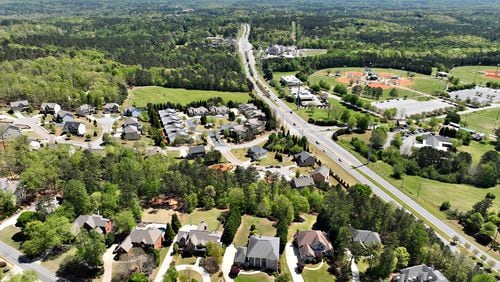 April 20, 2022 Powder Springs - Aerial photograph shows proposed area of the city of Lost Mountain in West Cobb on Wednesday, April 20, 2022.  Residential area near Lost Mountain Park (right) is shown in foreground. The story plays on a fear shared by many West Cobb residents as they decide whether to incorporate the city of Lost Mountain. The county they call home is changing around them, and as conservative political power wanes in the growing Atlanta suburb, many feel helpless to protect their neighborhoods from encroaching development.(Hyosub Shin / Hyosub.Shin@ajc.com)
